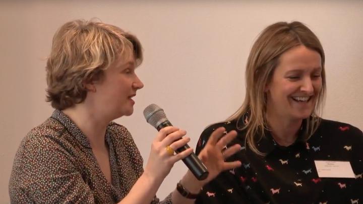 two women speaking during a panel talk