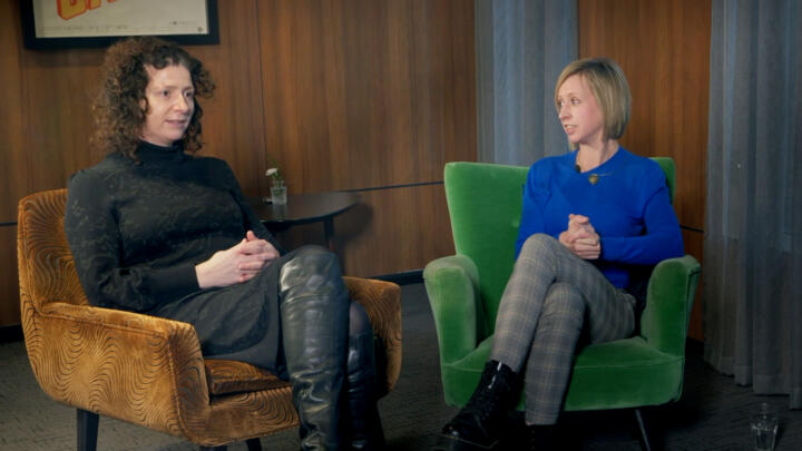 two women speaking during an interview